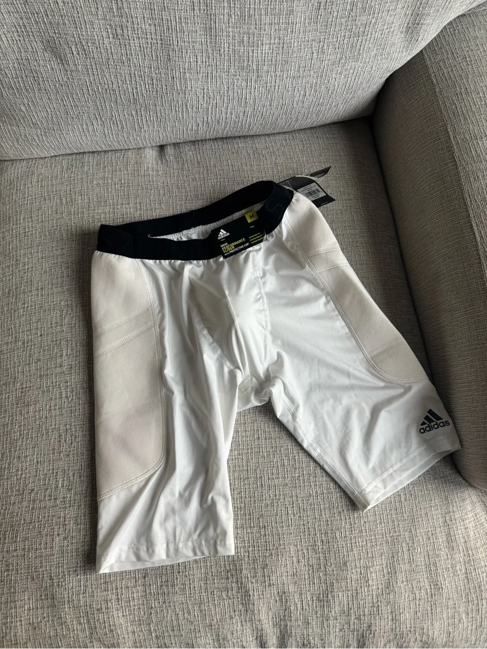 adidas Men's White performance slider with protective cup